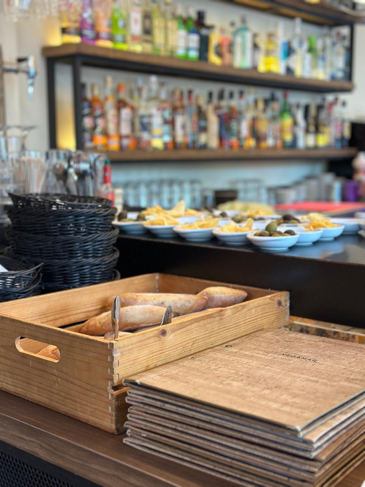The bar at Tandem, set with tapas, bread and menus